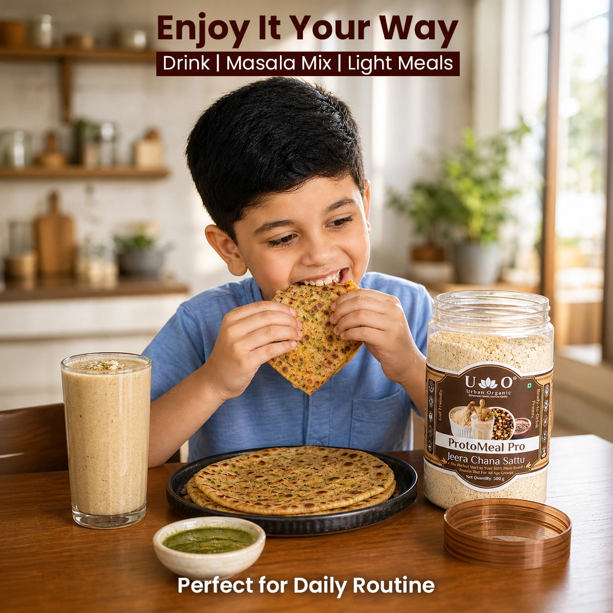 Young boy enjoying Urban Organic Jeera Chana Sattu with a paratha for a healthy daily meal
